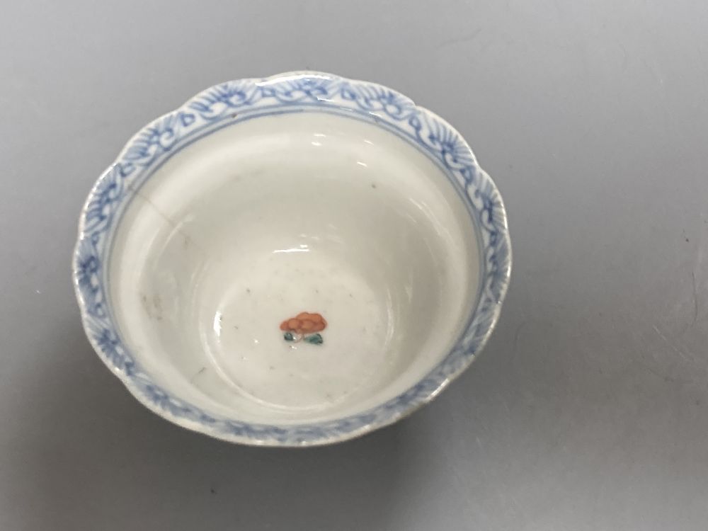 An 18th century English blue and white tea bowl and three smaller Chinese ceramic cups, two marks